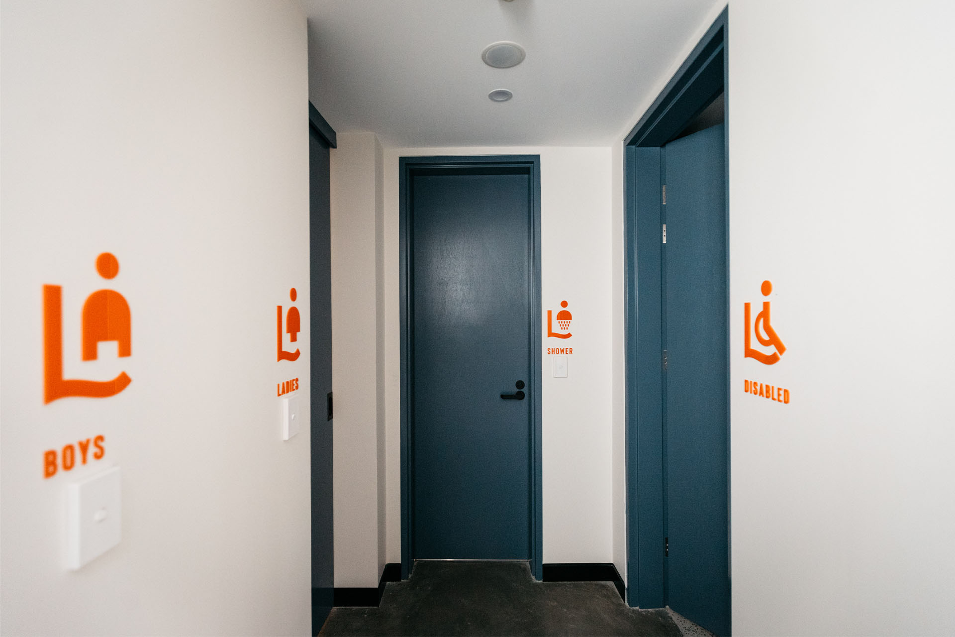 Doors showing female, male and disabled toilets, plus shower room